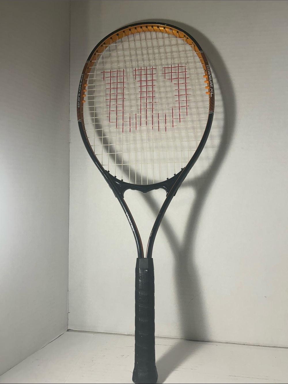 Wilson Tennis Racket — Black and Orange Accent. V-Mattix